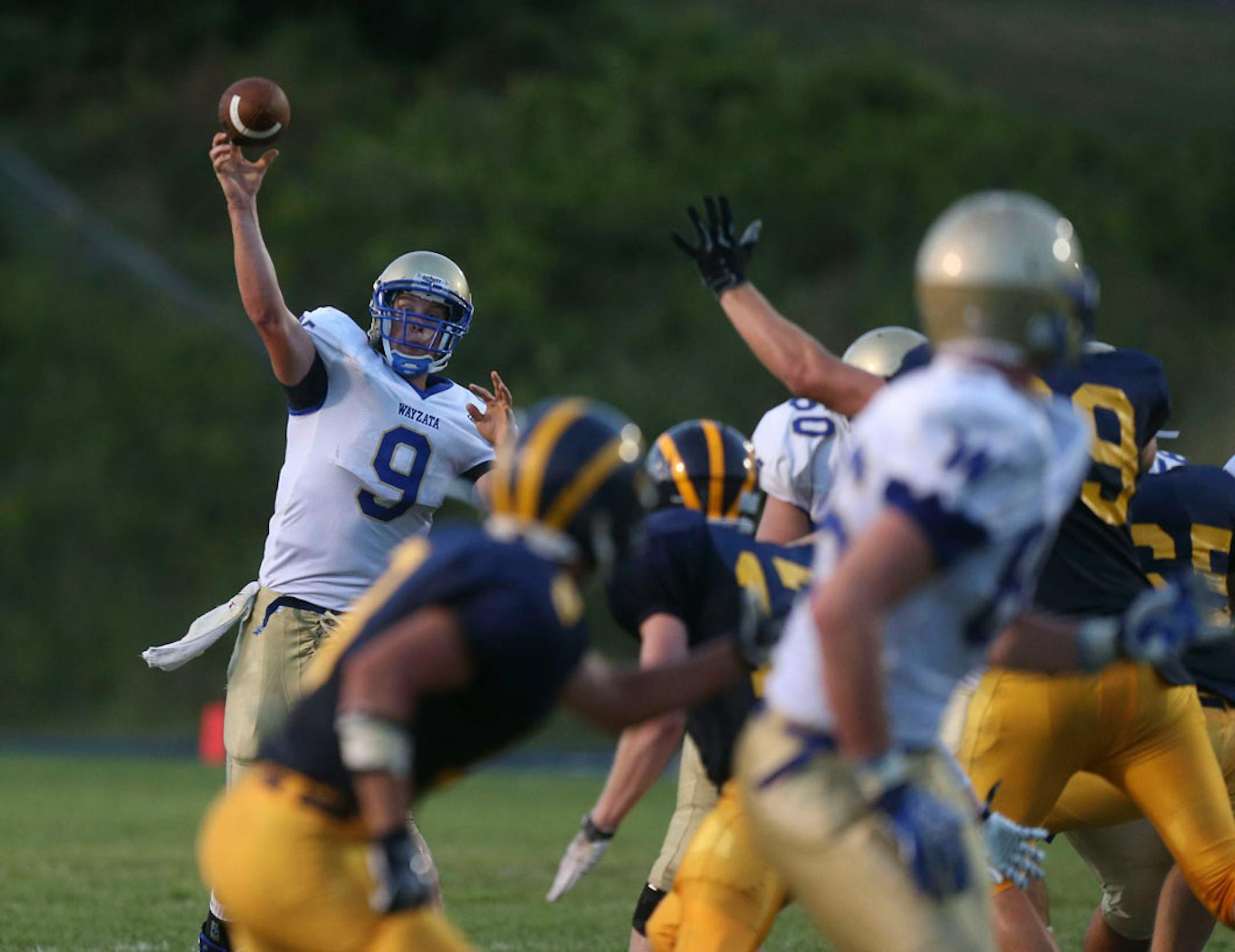 Wayzata's Andrew Reding threw a touchdown pass to Keante Johnson during second quarter action against Rosemount on Thursday, August 29, 2013.
