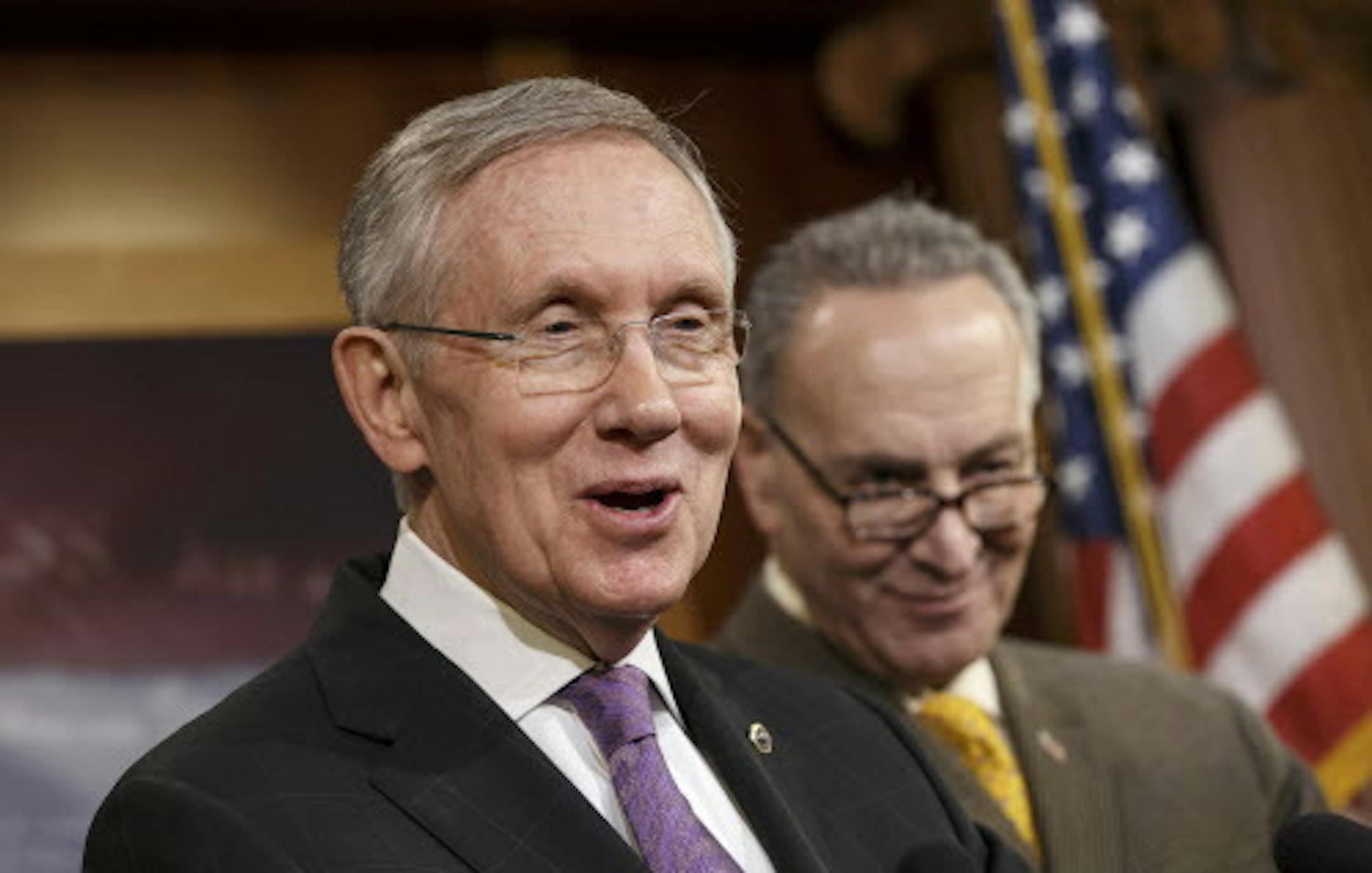 Senate Majority Leader Harry Reid, D-Nev., joined at right by Sen. Chuck Schumer, D-N.Y., talks to reporters about the final work of the Senate as their legislative year nears to a close, at the Capitol in Washington, Thursday, Dec. 19, 2013. Reid promises a vote no later than Jan. 7 on a measure to extend jobless benefits for three months. He said the number of jobless people out of work for more than six months is far greater than in past economic recoveries. (AP Photo/J. Scott Applewhite)