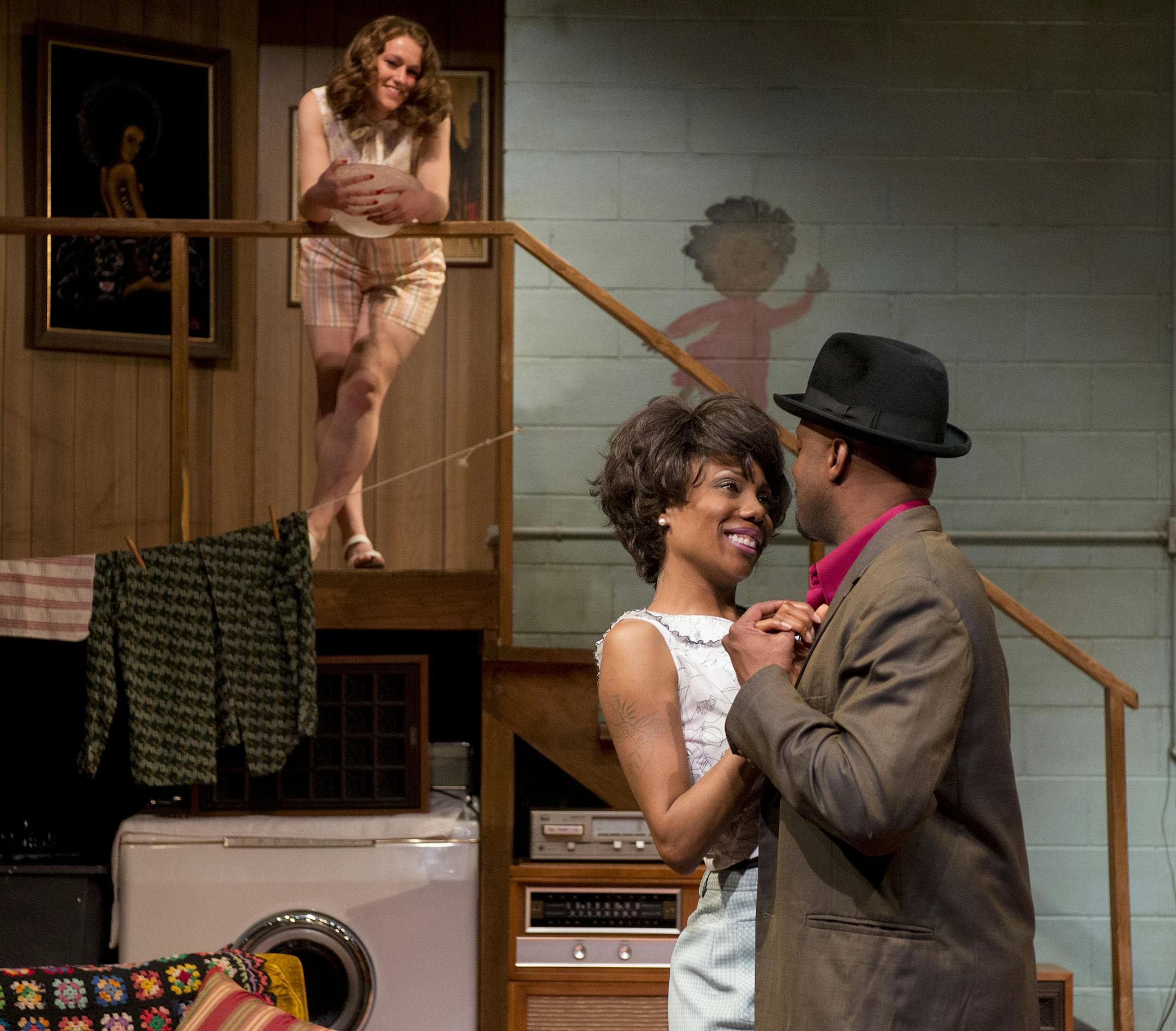 Chelle, played by Austene Van, and Sly, played by James T Alfred, dance while Caroline, played by Elizabeth Eftland, watches from the steps.] BRIDGET BENNETT SPECIAL TO THE STAR TRIBUNE • bridget.bennett@startibune.com During a rehearsal for Detroit '67 at Penumbra Theatre in St. Paul on April 17, 2015.