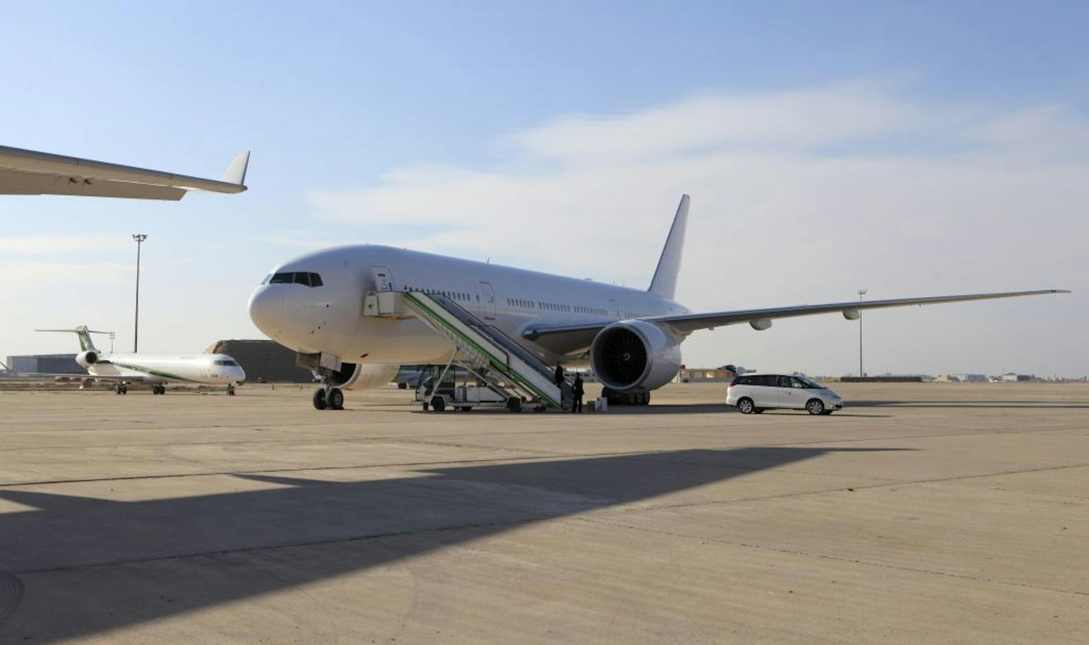 A Boeing 777 plane is seen after landing in Baghdad, Iraq, Saturday, Dec. 15, 2012. The first new Boeing jetliner sold to Iraq in years touched down in Baghdad on Saturday, signaling the country's determination to rebuild its economy after decades of war and sanctions.