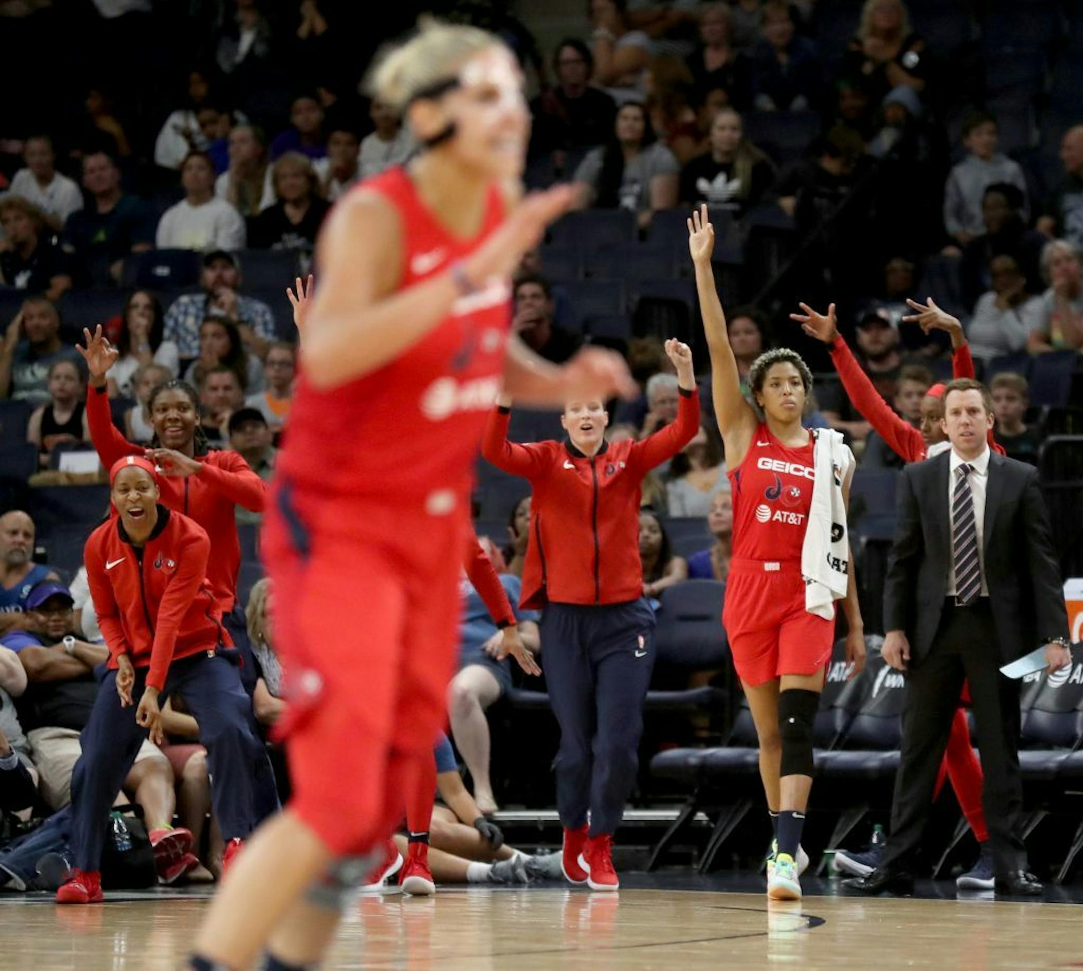 The Washington Mystics' bench celebrates a three point basket with under a minute to play during their team's 86-79 win over the Lynx Friday, Aug. 16, 2019, at the Target Center in Minneapolis, MN.