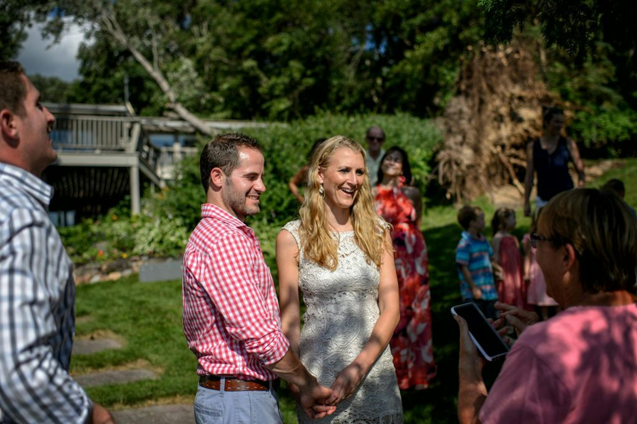 Groom Kevin Relf and Bride Brianna Sucik rehearsed their wedding vows next to the fallen 90-foot maple in the front yard of her mom and stepfather's home on Gull Lake.