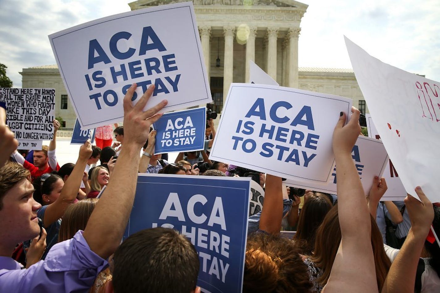 Supporters of the Affordable Care Act rallied outside the U.S. Supreme Court in June on the day the court ruled that the law may provide nationwide tax subsidies to help people buy health insurance.