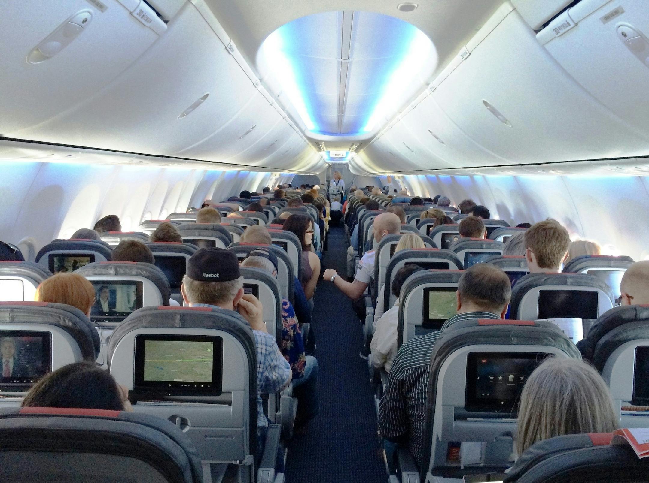 One of American Airlines' new 737s. The cabin gives standard economy passengers less space, but also an entertainment system to distract them. (Josh Noel/Chicago Tribune/MCT) ORG XMIT: 1154887