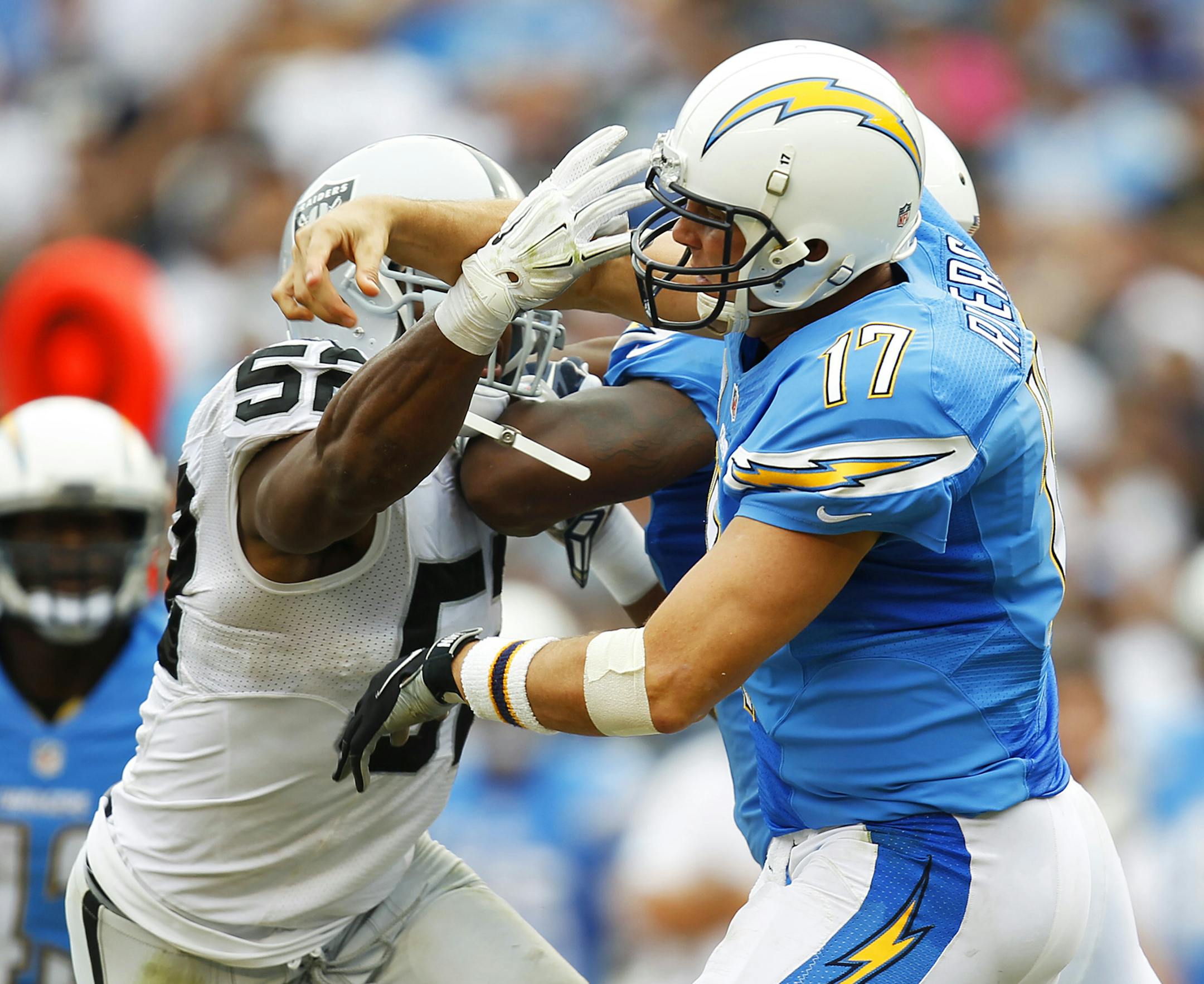 San Diego Chargers quarterback Philip Rivers is hit by Oakland Raiders' Khalil Mack on an incomplete pass during the fourth quarter on Sunday, Oct. 25, 2015, at Qualcomm Stadium in San Diego. (K.C. Alfred/San Diego Union-Tribune/TNS) ORG XMIT: 1175667