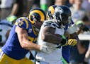 Seattle Seahawks defensive tackle Sheldon Richardson is tackled after recovering a fumble against the Los Angeles Rams during the second half of an NF