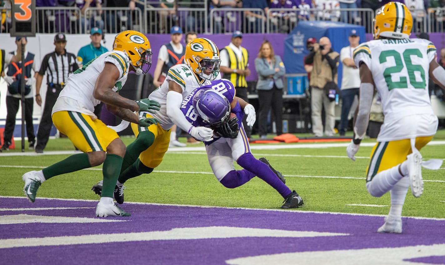 Vikings wide receiver Justin Jefferson (18) plowed through Packers cornerback Rasul Douglas (29), left, and Packers safety Henry Black (41) and into the end zone for a touchdown during the third quarter, Sunday, Nov. 21, 2021 in Minneapolis, Minn. The Minnesota Vikings hosted the Green Bay Packers at U.S. Bank Stadium. ] ELIZABETH FLORES • liz.flores@startribune.com