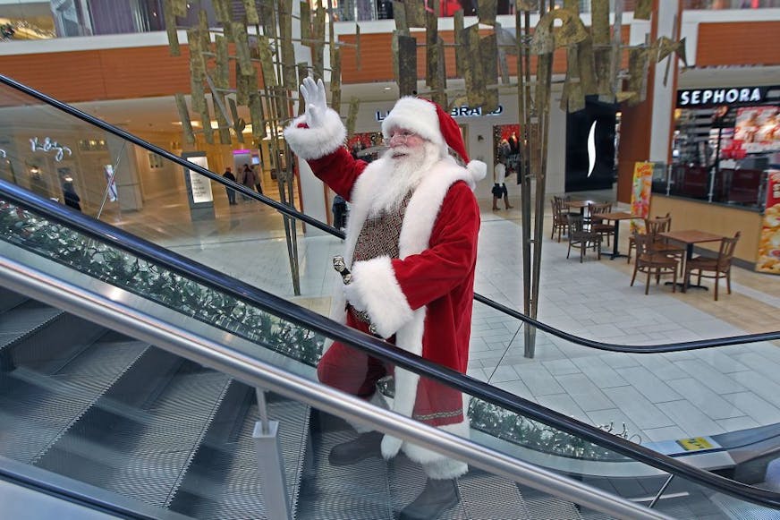 "Santa" waved to people as he made his way to the Christmas photo booth at Southdale Mall, Friday, December 4, 2015 in Edina, MN.