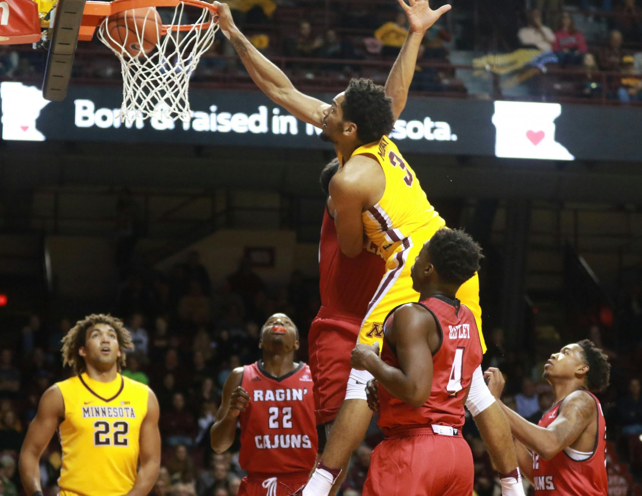 The University of Minnesota's Jordan Murphy (3) dunks against La.-Lafayette during the second half of the Gophers 86-74 win Friday, Nov. 11, 2016, at Williams Arena on the University of Minnesota campus in Minneapolis, MN.
