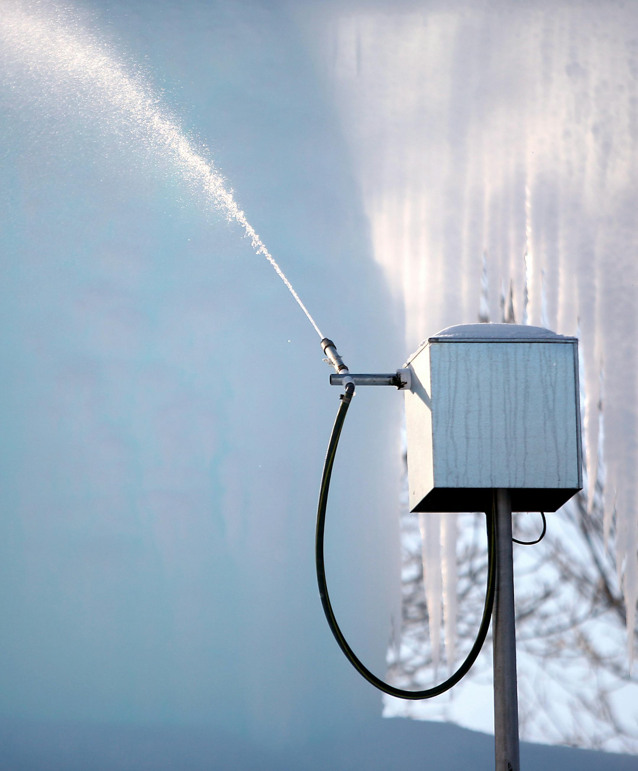 An automated sprayer constantly douses the ice sculpture in Hanson's backyard, using waste water from a geothermal system.
