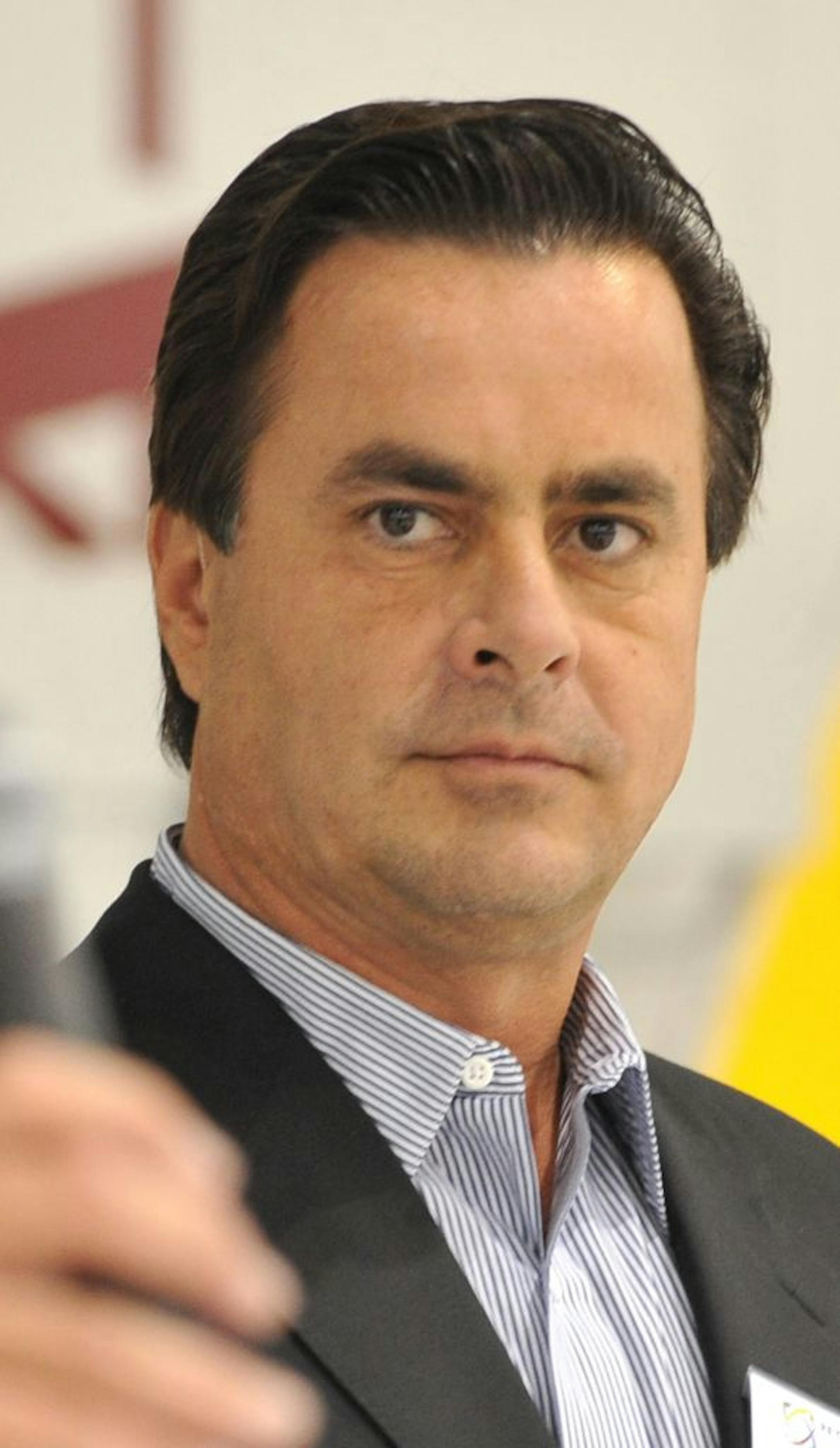 Tom Petters is introduced by President of Petters Aviation Jay Salmen, Petters then spoke to employees and invited guests at an open house for Petters Aviation at Minneapolis St. Paul International Airport.