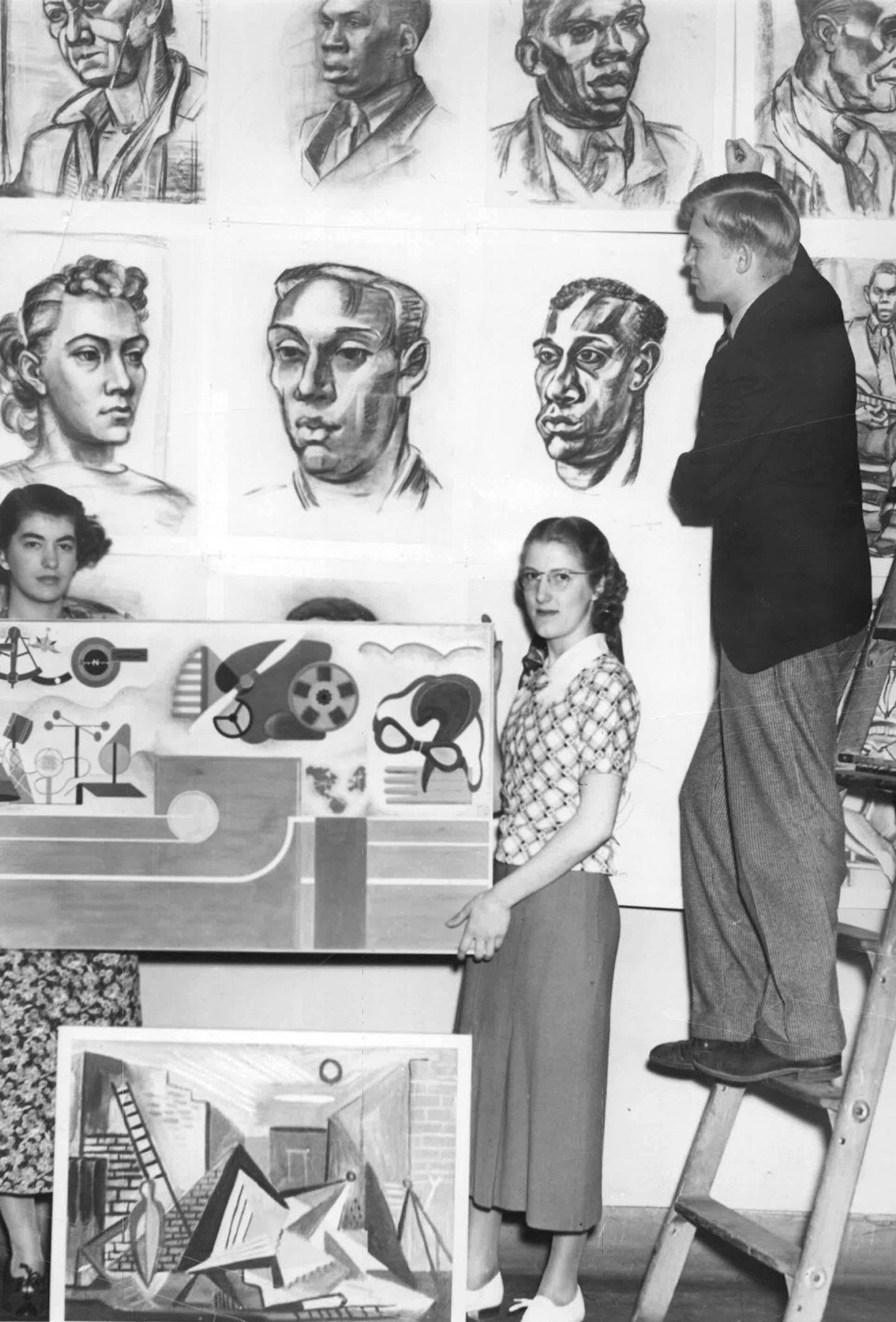 May 18, 1937: Artists install their work for a student art exhibition at the St. Paul School of Art (a predecessor of Minnesota Museum of American Artt). Archival photo courtesy of Minnesota Museum of American Art.