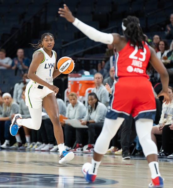 Minnesota Lynx guard Diamond Miller dribbles up the court in the first quarter of the Lynx first preseason game against the Washington Mystics Friday,