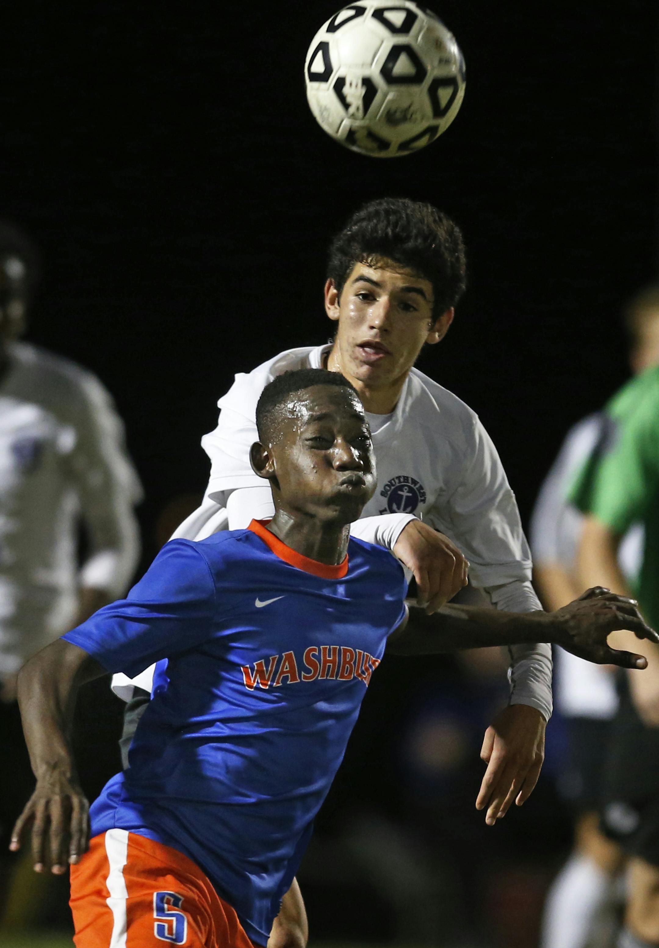 At Southwest H.S. in the AA Section 6 final game against Washburn, Juan Louis(5) tried to get control of the ball with Sam Stovitz(6) right behind him.] Richard Tsong-Taatarii/rtsong-taatarii@startribune.com