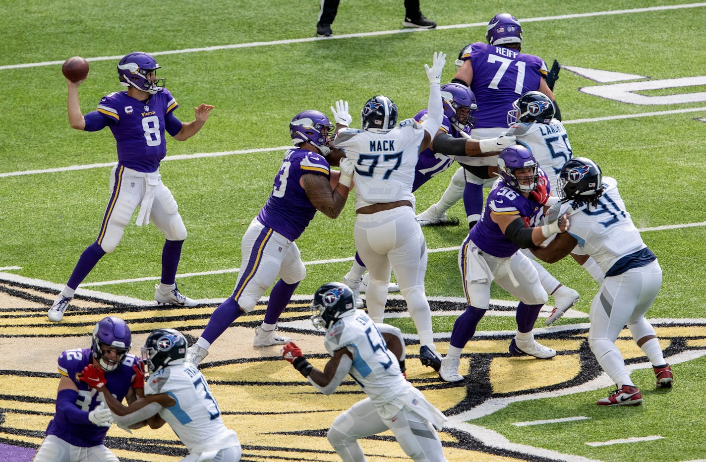 Minnesota Vikings offensive line and Kirk Cousins (8).