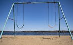 An empty swing set sat on the beach behind Cragun's Resort on Gull Lake on Monday. ] ALEX KORMANN • alex.kormann@startribune.com Resorts around Minn