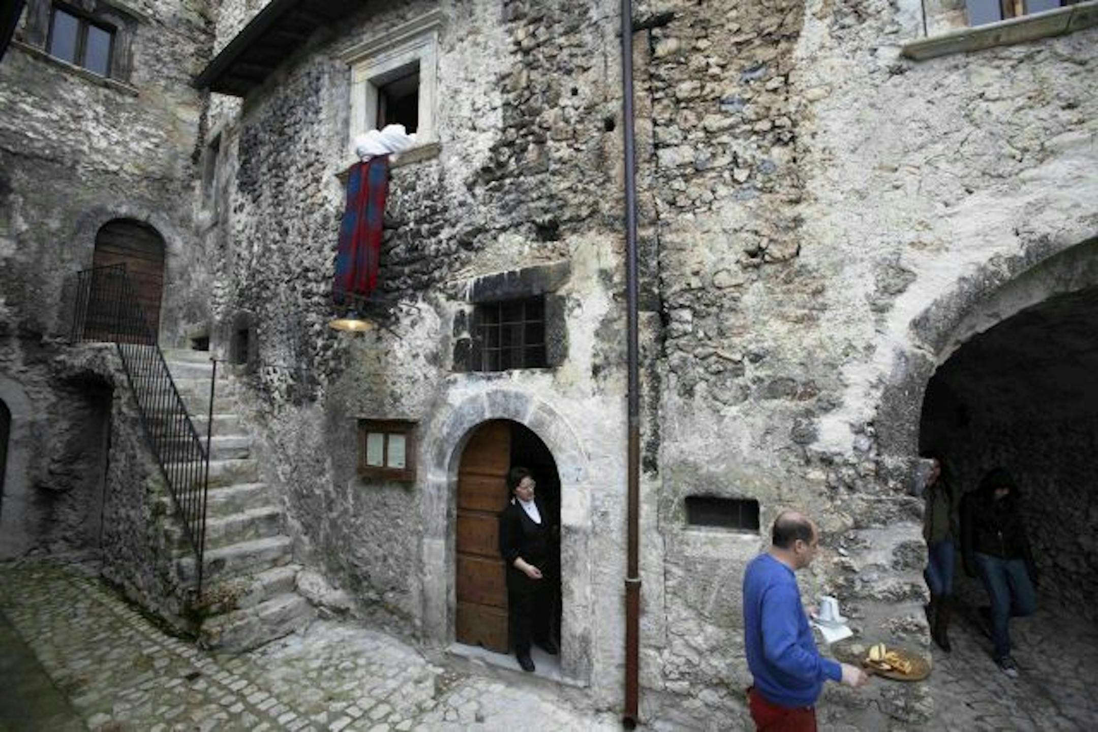 Linens are changed and snacks are brought to a room at the albergo diffuso Sextantio, in Santo Stefano di Sessanio, Italy, April 5, 2010. The albergo diffuso, an inn with rooms scattered around a town, is an attempt to bring tourism to distressed villages in Europe while sustaining their traditions.