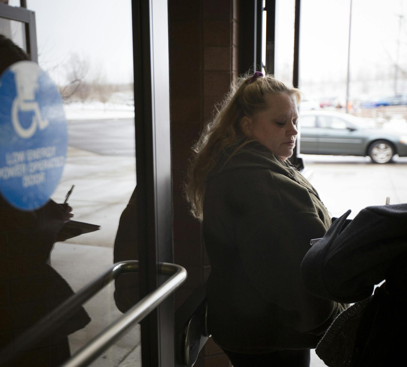 Carlee Bollig's mother Jenny Bollig spoke to a reporter at the entrance to the Sherburne County Government Center after her daughter's sentencing on Friday, March 4, 2016, in Elk River, Minn. ] RENEE JONES SCHNEIDER &#x2022; reneejones@startribune.com Carlee Bollig, a 17-year-old from Little Falls, ran a red light while texting, killing a father and his daughter.