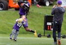 Vikings receiver Troy Stoudermire played with 7-year-old fan Obadiah Gamble after OTA training at Winter ParkThursday Jun 1 2016 in Eden Prairie , MN.