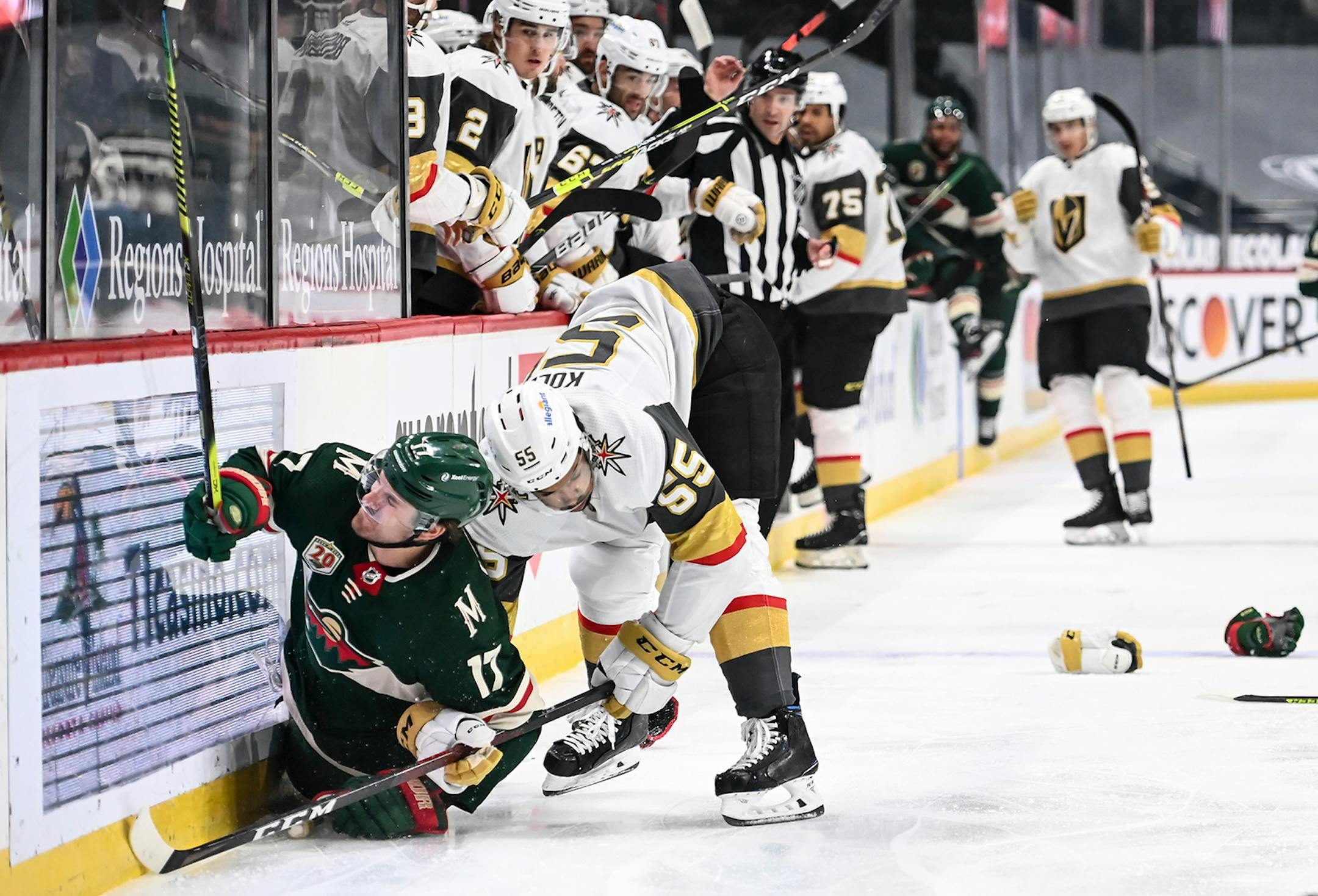 Minnesota Wild left wing Marcus Foligno (17) and Vegas Golden Knights right wing Keegan Kolesar (55) collided against the boards in the first period.