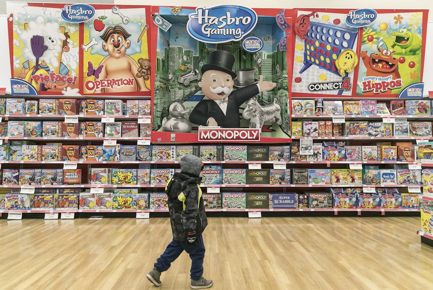 A boy walks around a Toys "R" Us last year in New York.