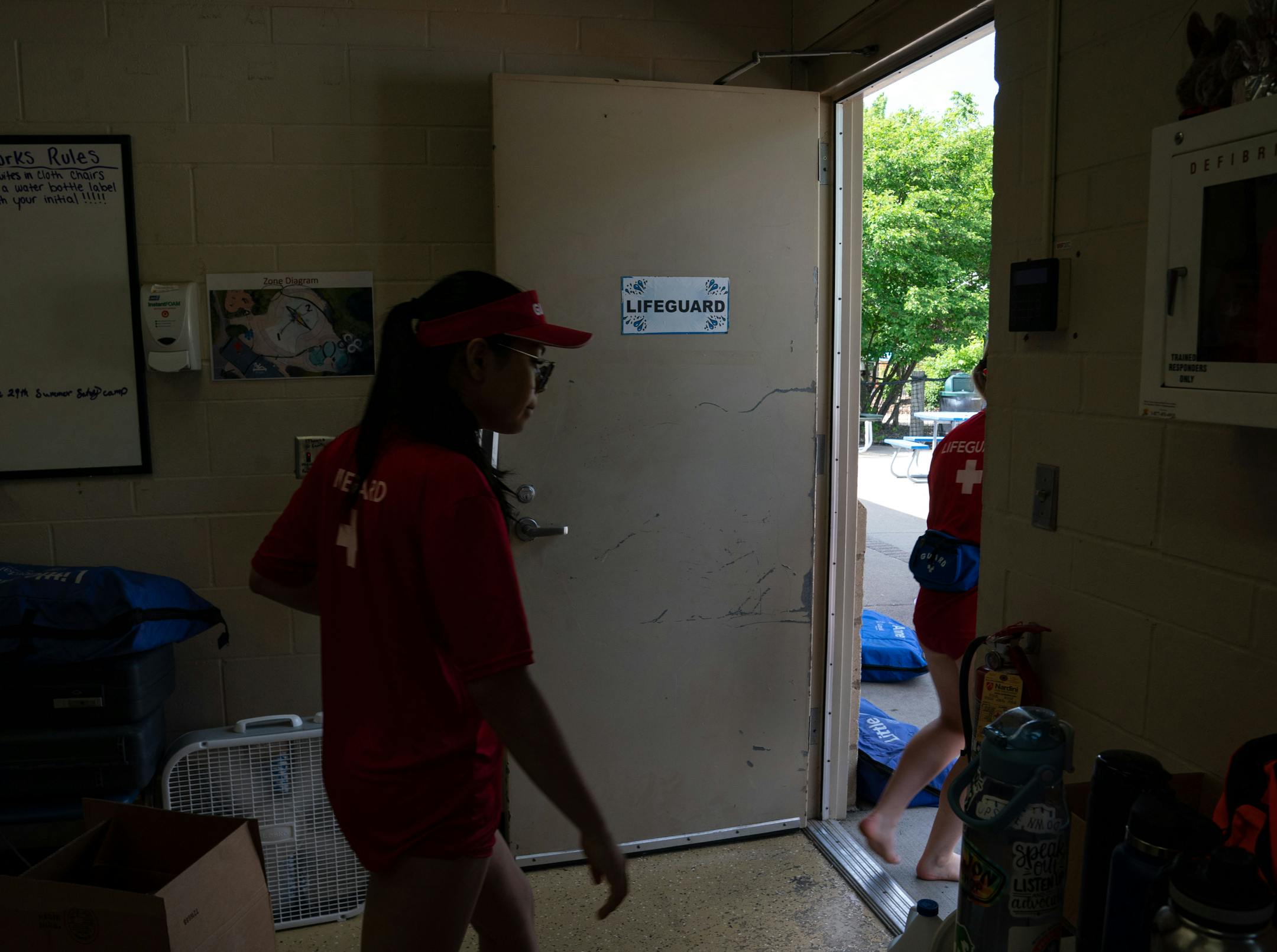 Lifeguards-in-training leave the break room during a training program for new Ramsey County lifeguards.