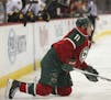 Wild left wing Zach Parise (11) struggled to get to his feet after a hit into the boards in the first period Thursday night. ] JEFF WHEELER &#xef; jef