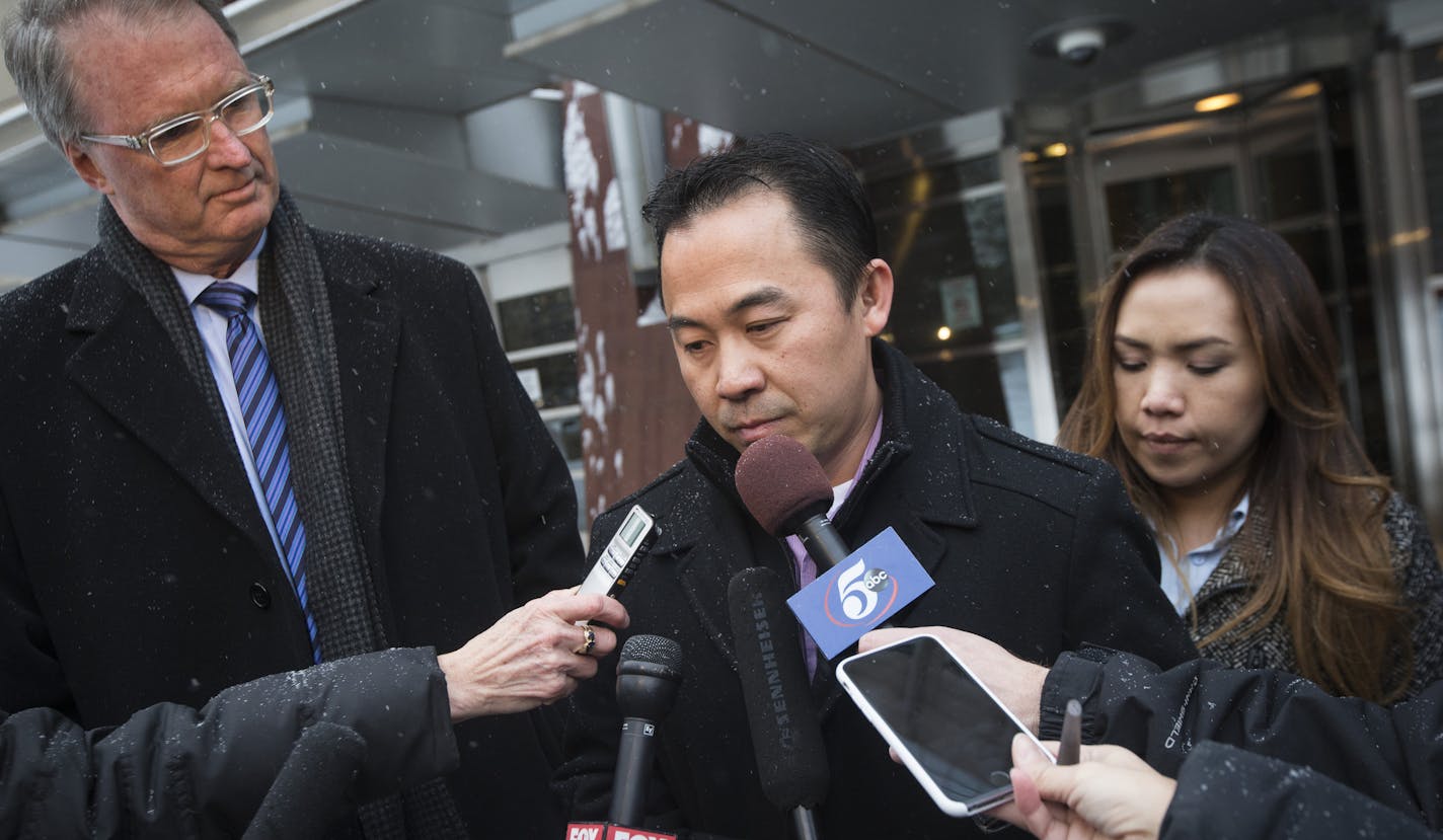 Koua Fong Lee stood with his wife Panghoua Moua, right, and attorney Bob Hilliard, left, after a verdict in the Toyota liability trial that found the automaker 60 percent responsible and Lee 40 percent responsible for a 2006 crash that caused the deaths of three people and sent a St. Paul man to prison for more than two years, outside the Federal Courthouse in downtown Minneapolis, Minn. on Tuesday, February 3, 2015. ] RENEE JONES SCHNEIDER &#x2022; reneejones@startribune.com