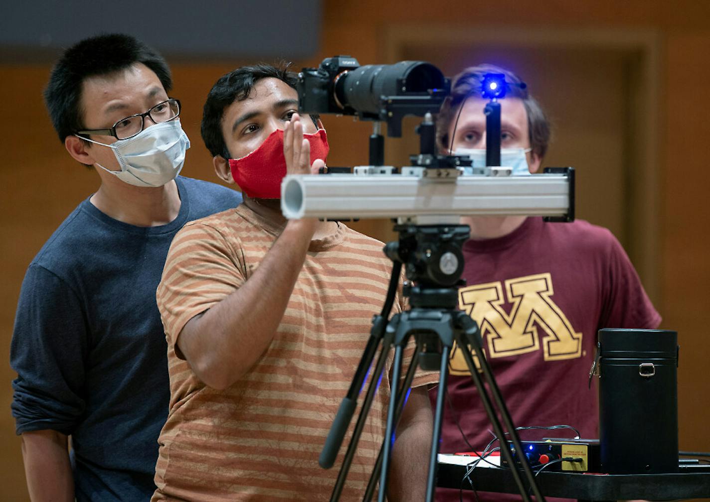 Prof. Jiarong Hong, left, and students Santosh Sankar, center, and Maximilian Trifonov conducted testing that could have broad implications for science and public health policy.