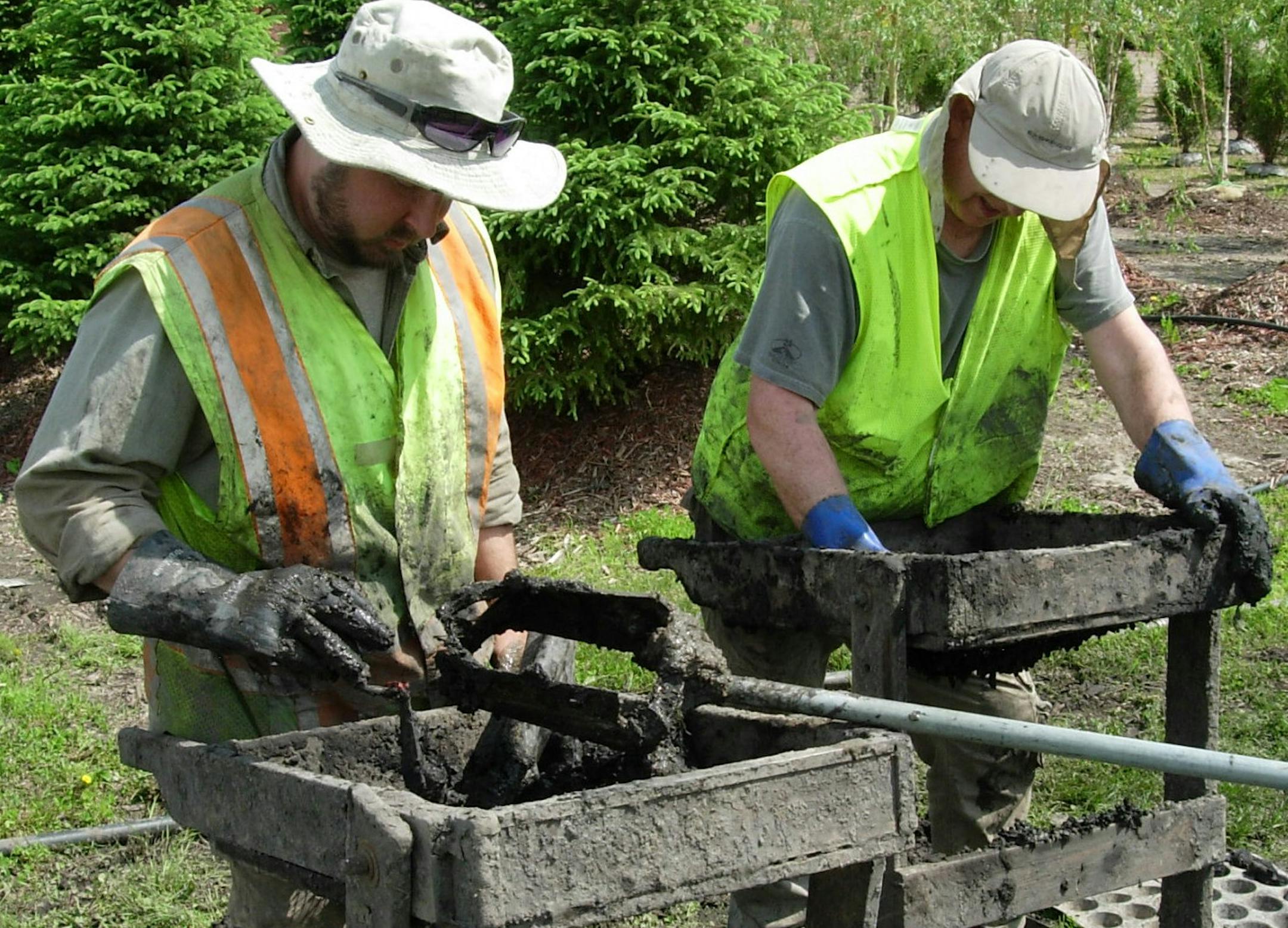 Mike Bradford and Bob Thompson screened soil from an 8,000-year-old campsite along the Minnesota River.