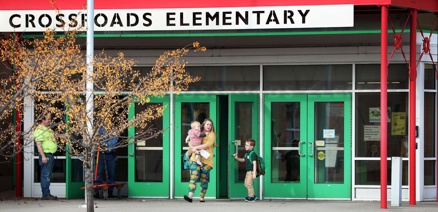 A loaded handgun brought to Crossroads Elementary School by a seven-year-old first grade student discharged one round but no one was hurt Thursday, Nov. 17, 2016, in St. Paul, MN. Here, parents pick up their children from the school Thursday afternoon.] (DAVID JOLES/STARTRIBUNE)djoles@startribune.com A loaded handgun brought to Crossroads Elementary School by a seven-year-old first grade student discharged one round but no one was hurt Thursday, Nov. 17, 2016, in St. Paul, MN.