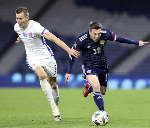 Scotland's Callum McGregor, right, and Slovakia's Jan Gregus battle for the ball during the UEFA Nations League soccer match between Scotland and Slov