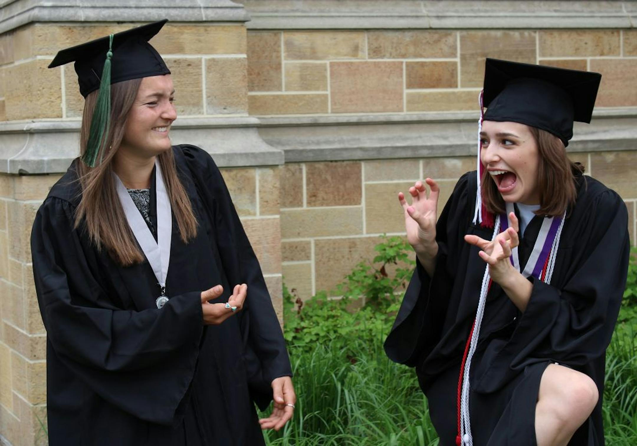 So happy together: Teresa Luterbach caught this playful moment between her daughter, Olivia (right), and her roommate/friend Annie as they graduated from University of St. Thomas in 2015.