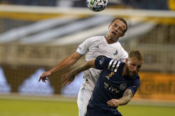 The Loons' Chase Gasper, top, and Sporting KC's Johnny Russell battled during a 1-0 Minnesota road loss Sept. 13.