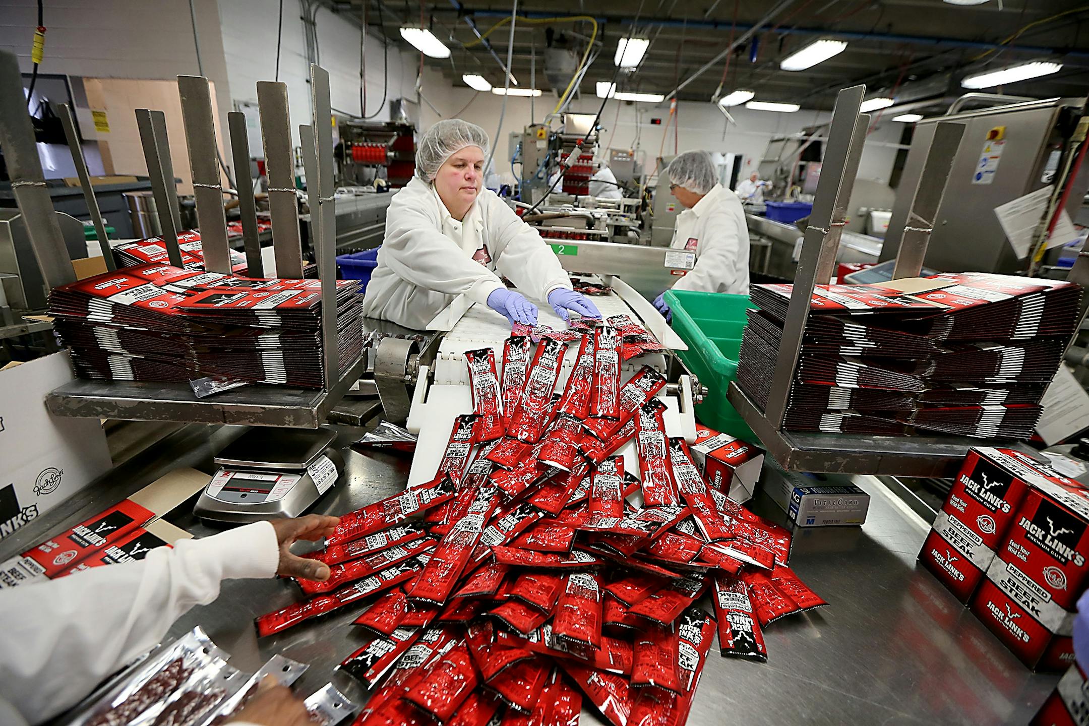 Workers processed Jack Links beef jerky in the packaging area, Monday, October 19, 2015 in Minong, Wis.