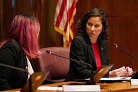 St. Paul City Council member Mitra Jalali Nelson spoke with fellow Council member Rebecca Noecker during discussion the $15 minimum wage ordnance befo
