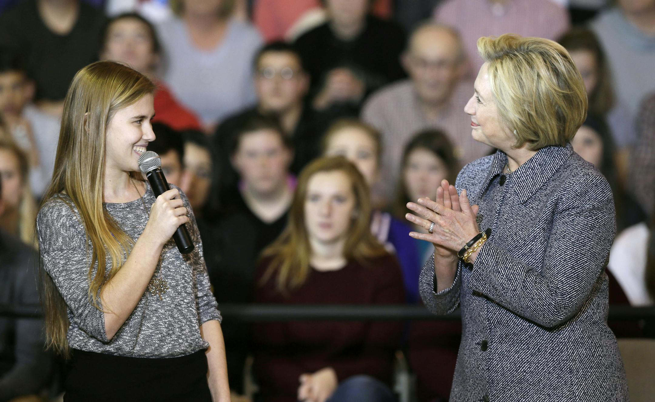 Democratic presidential candidate Hillary Clinton reacts as she is introduced by student Abby Schulte to speak at a town hall meeting at Keota High School, Tuesday, Dec. 22, 2015, in Keota, Iowa. (AP Photo/Charlie Neibergall)