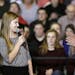 Democratic presidential candidate Hillary Clinton reacts as she is introduced by student Abby Schulte to speak at a town hall meeting at Keota High Sc