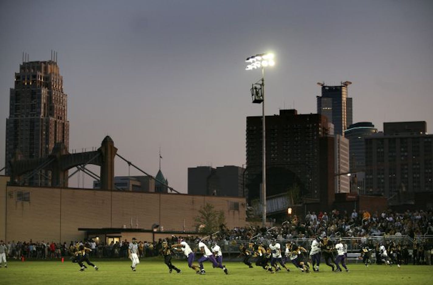 With the Minneapolis skyline as a backdrop, DeLaSalle took on Brooklyn Center at the team's new Nicollet Island stadium, Friday night.