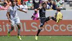 New York City FC forward David Villa, right, of Spain, kicks the ball as Los Angeles Galaxy defender Omar Gonzalez watches during the first half of an