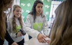 Mounds View High students Hannah Berndt, left, and Sanjana Dutt, center, from H.E.A.R.T - Helping Every At-Risk Teen - organized a wellness week by ha