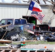 Flags fly from a truck in Rockport, Texas, on Tuesday, Aug. 29, 2017, following Hurricane Harvey. (Rachel Denny Clow/Corpus Christi Caller-Times/TNS) 