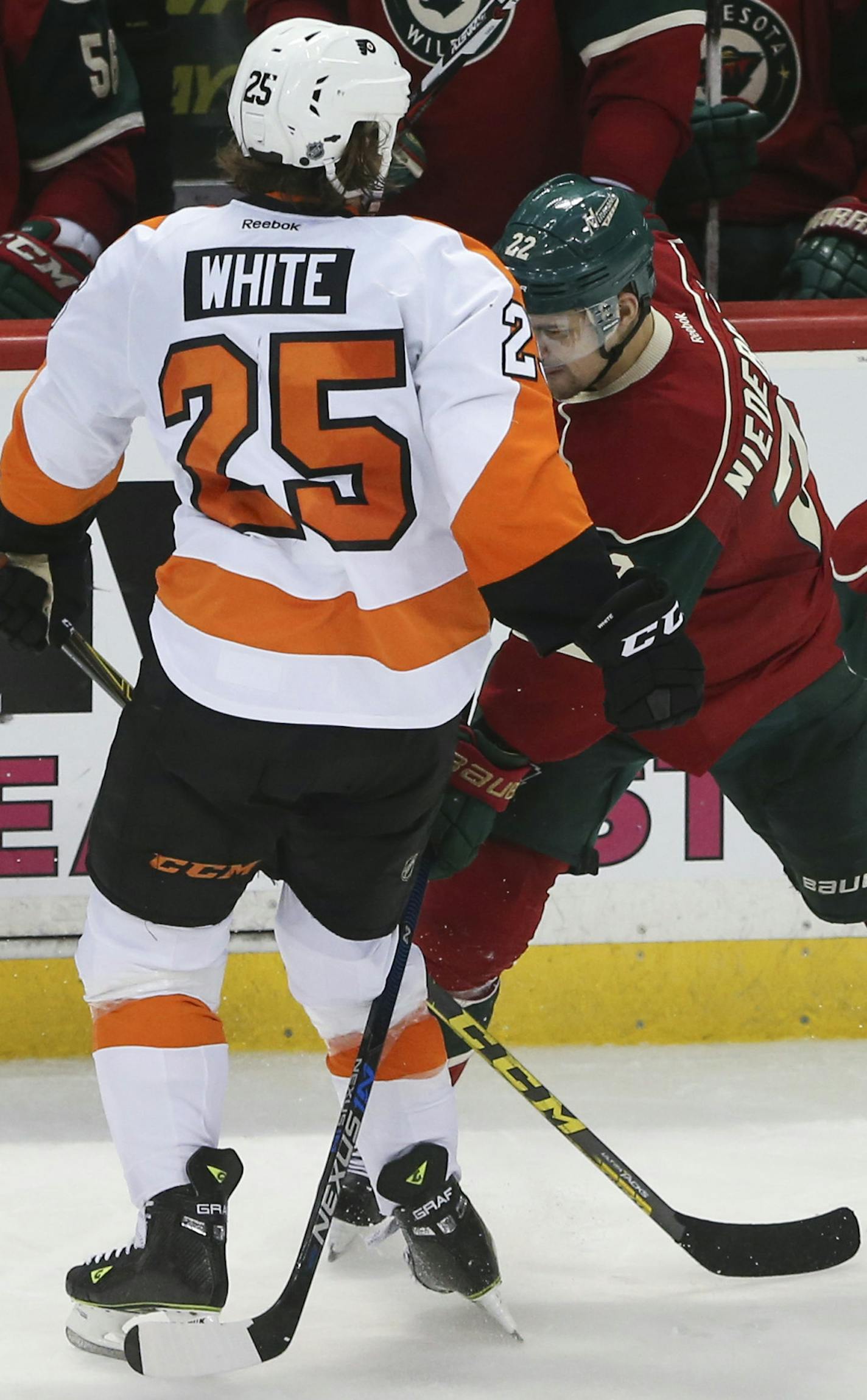 Wild right wing Nino Niederreiter (22) slashed Philadelphia Flyers center Ryan White (25) for a penalty in the third period Thursday night. White had dropped Niederreiter to the ice a few moments before, an incident that went unnoticed by officials. ] JEFF WHEELER &#xef; jeff.wheeler@startribune.com The Minnesota Wild lost 4-3 in overtime to the Philadelphia Flyers in an NHL hockey game Thursday night, January 7, 2016 at Xcel Energy Center in St. Paul.