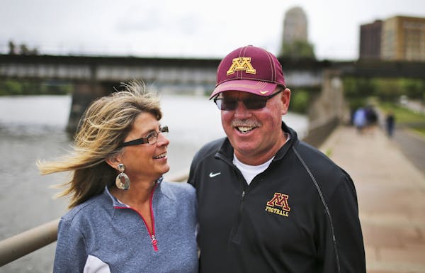 University of Minnesota football coach Jerry Kill and his wife Rebecca walked the trail along the Mississippi River near downtown Minneapolis Saturday