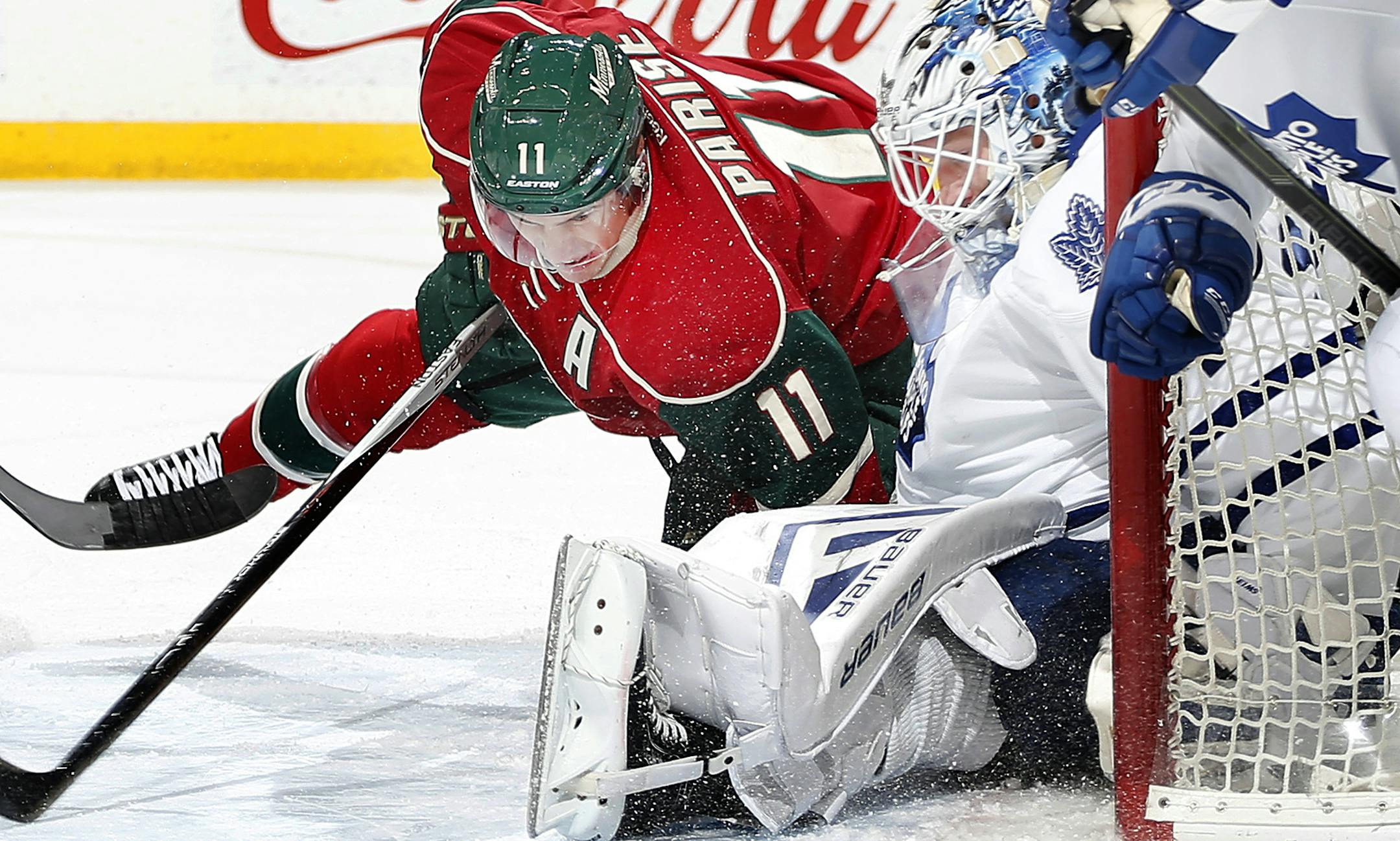 Zach Parise (11) collided with Maple Leafs goalie James Reimer (34) in the first period. ] CARLOS GONZALEZ &#xef; cgonzalez@startribune.com - December 3, 2015, St. Paul, MN, Xcel Energy Center, NHL, Minnesota Wild vs. Toronto Maple Leafs