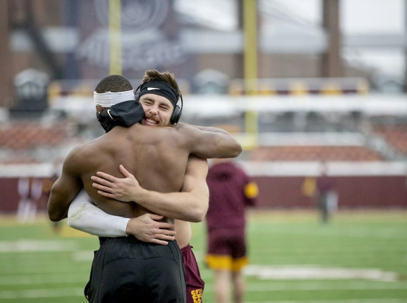 Gophers linebackers Carter Coughlin, right, and Kamal Martin, braved the cold and shared a hug while they were warming up before the Wisconsin game last November.