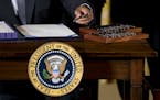 President Barack Obama signs H.R. 2146 Defending Public Safety Employees&#xed; Retirement Act and H.R. 1295 Trade Preferences Extension Act of 2015, M