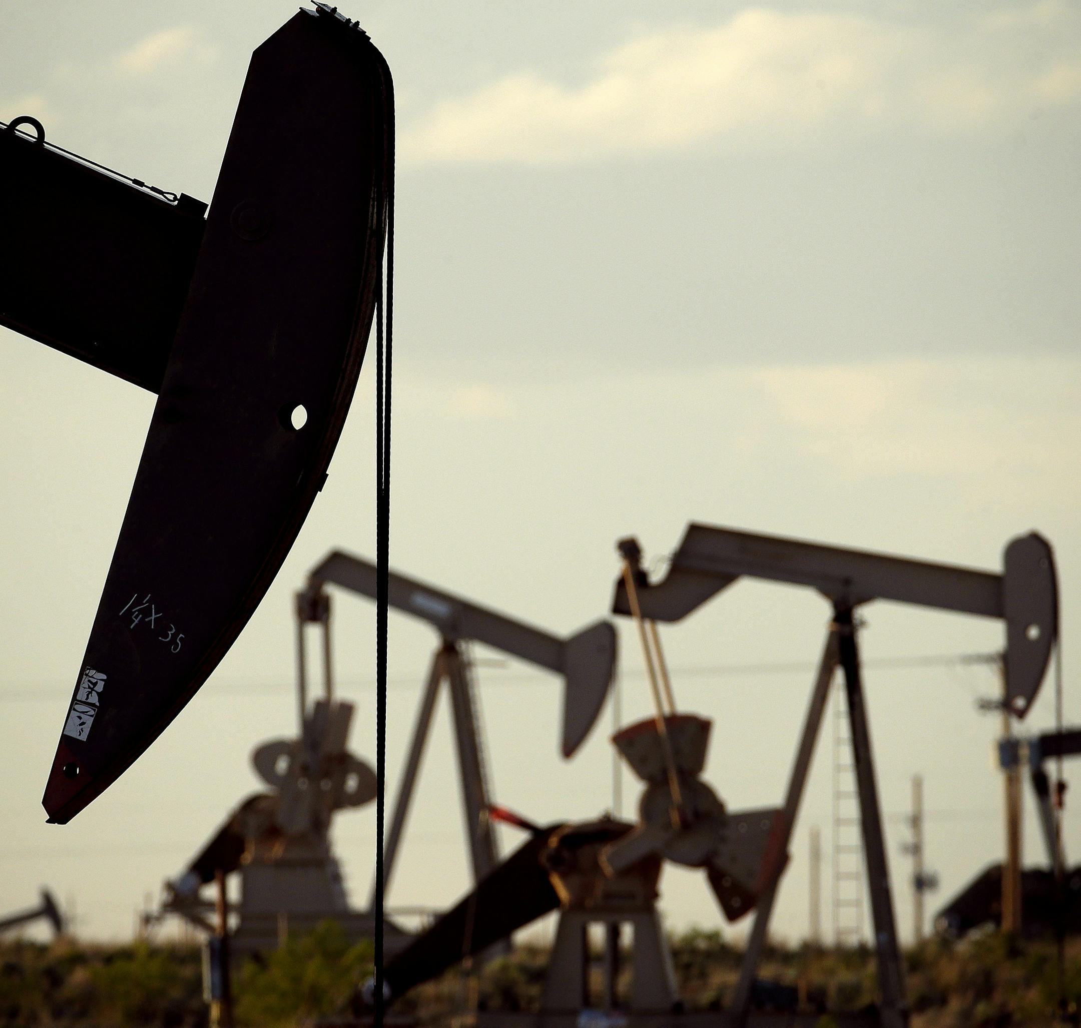 ADVANCE FOR USE TUESDAY, SEPT. 8, 2015 AND THEREAFTER - In this April 24, 2015 photo, pumpjacks work in a field near Lovington, N.M. As oil production in the United States rose in recent years, so did the spills of salty wastewater that is also pumped to the surface. A big reason why there are so many spills is the sheer volume of wastewater extracted - about 10 barrels for every barrel of oil, according to an organization of state ground water agencies. (AP Photo/Charlie Riedel)