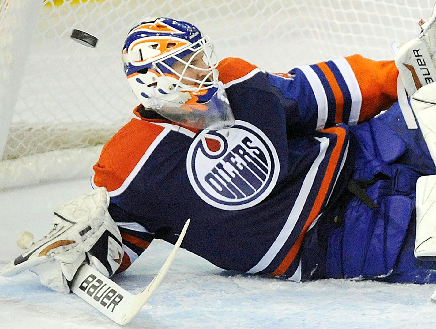 Edmonton Oilers goalie Devan Dubnyk makes a save against the Minnesota Wild during second-period NHL hockey game action in Edmonton, Alberta, on Friday, April 8, 2011. (AP Photo/The Canadian Press, John Ulan)