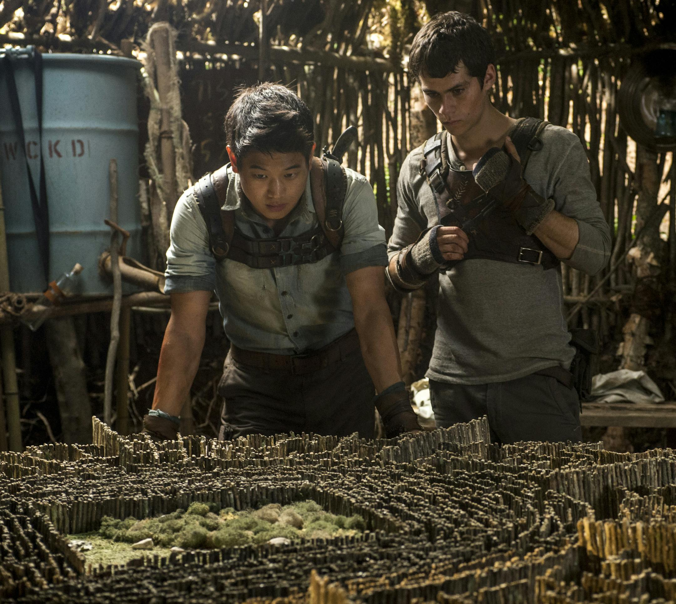 THE MAZE RUNNER Minho (Ki Hong Lee, left) and Thomas (Dylan O'Brien, right) devise an escape plan. Ph: Ben Rothstein TM and &#xac;&#xa9; 2014 Twentieth Century Fox Film Corporation. &#xac;&#x2020;All Rights Reserved. &#xac;&#x2020;Not for sale or duplication.